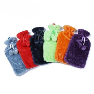 PVC hot water bag + plush fabric cover with pom-poms